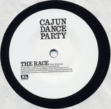 Cajun Dance Party : The Race (7", Single, Ltd + CD, Single, Ltd)